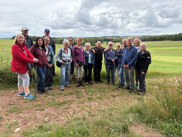 group of walkers standing by a field